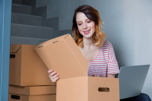 woman opening cardboard moving box - Photo, Image