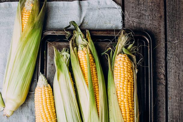 Fresh corn cob on table - Φωτογραφία, εικόνα