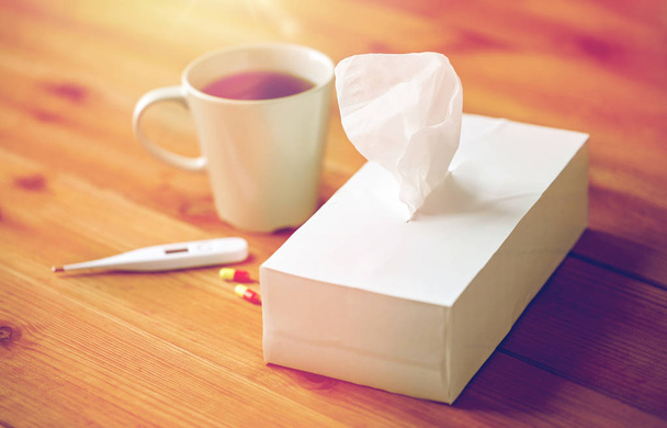 cup of tea, paper wipes and thermometer with pills - Foto, Imagem