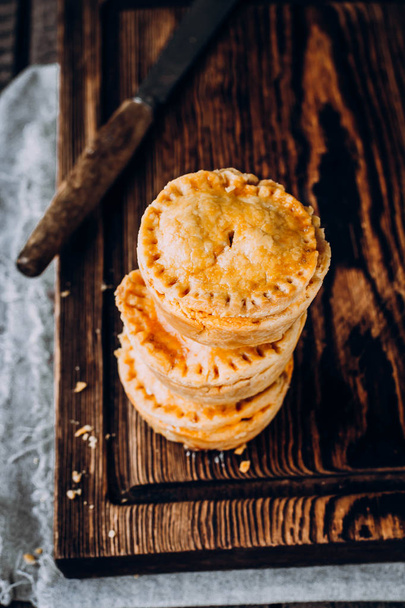 Australian meat pies on wooden table - Photo, image