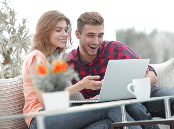young couple looking at a laptop screen - Photo, Image