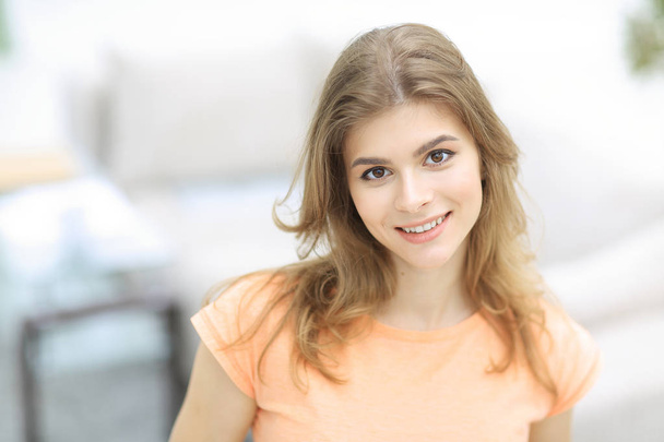 closeup portrait of a young woman on blurred background. - Фото, зображення