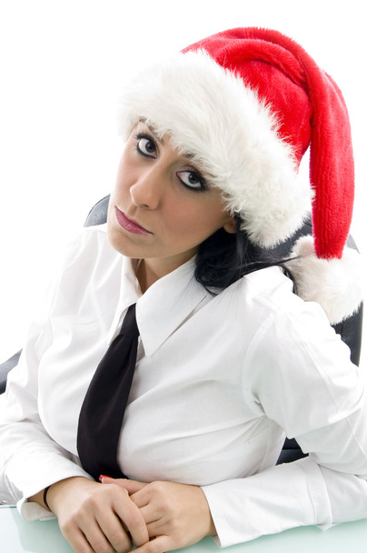 Young woman at work in christmas hat - Фото, зображення