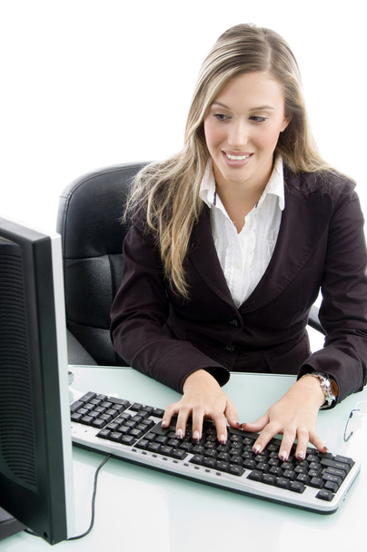 Blonde woman working on computer - Foto, afbeelding