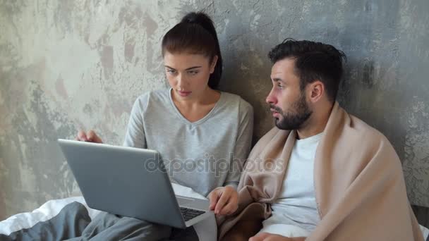 Loving wife helping her sick husband with work - Πλάνα, βίντεο