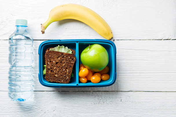 Picture of fitness snack in lunch box - Фото, изображение