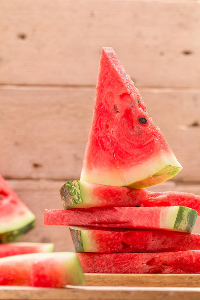 Fresh sliced watermelon  on wooden table. - Foto, immagini