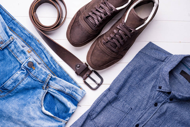 male jeans and shirt with brown belt and shoes - Фото, изображение