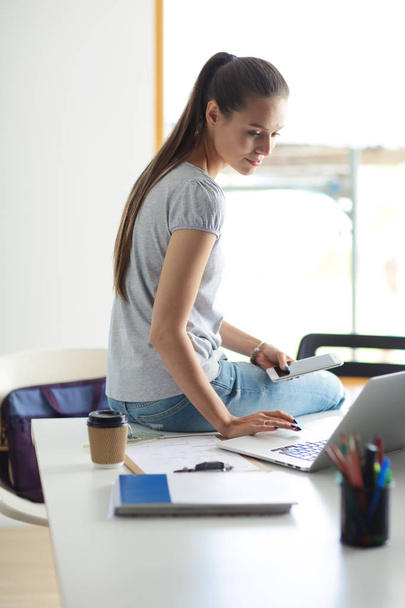Portrait of student girl working on laptop. Student girl - Fotografie, Obrázek