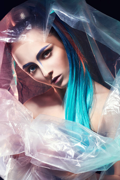beauty woman with blue hair,in plastic - 写真・画像