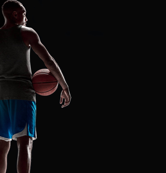 The hand of a basketball player with ball - Valokuva, kuva