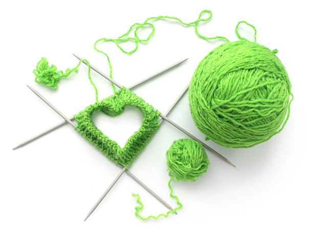 Knitted heart on needles with yarn - Photo, Image