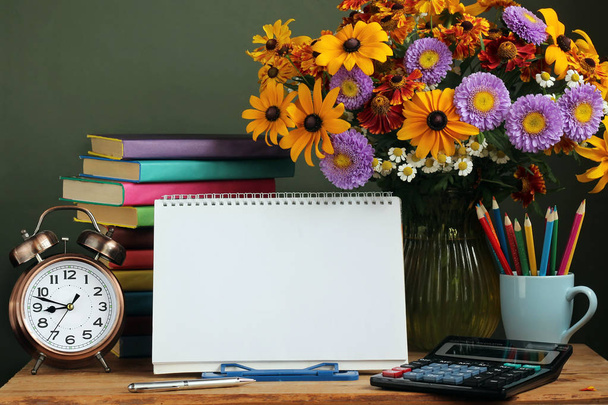 Teacher's day, September 1. Back to school. Bouquet and book. - Photo, Image