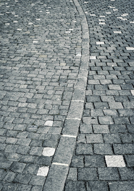 arc on stone pavement with cubes - Foto, Bild