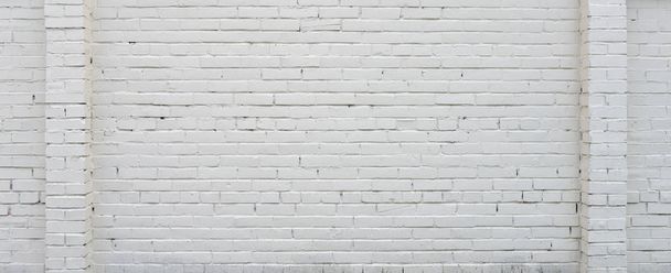 Brick wall painted with white paint. - Φωτογραφία, εικόνα