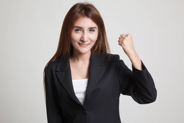 Successful  young Asian woman hold fist up. - Φωτογραφία, εικόνα