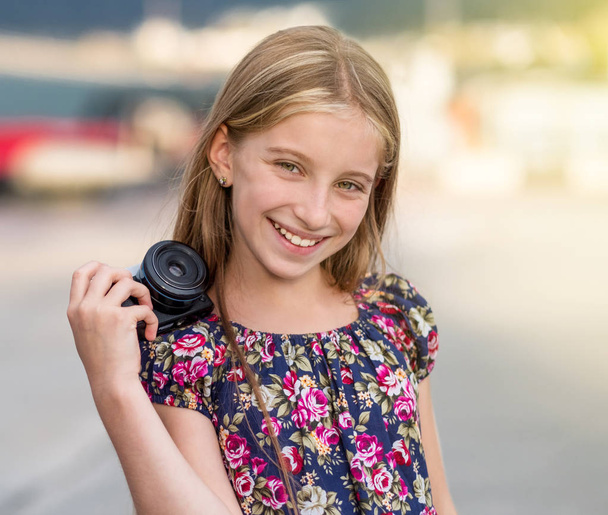 Little girl with camera - 写真・画像