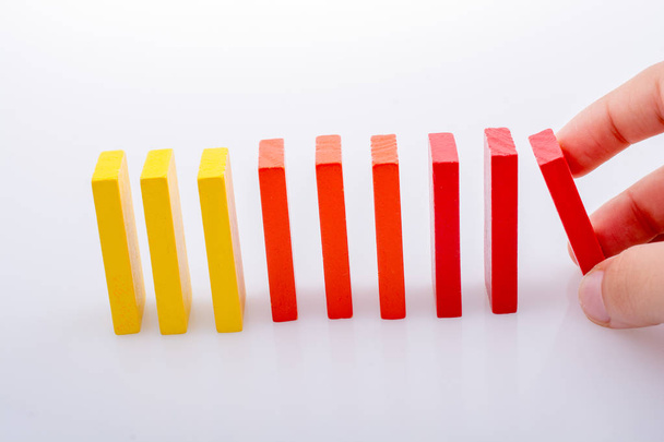 Hand holding color dominoes - Фото, зображення