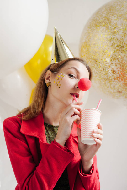 woman holding cup and drinking - 写真・画像