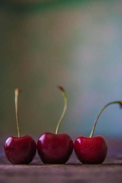 Cherry on wooden board. Tree cherries, selective focus - Foto, Imagem