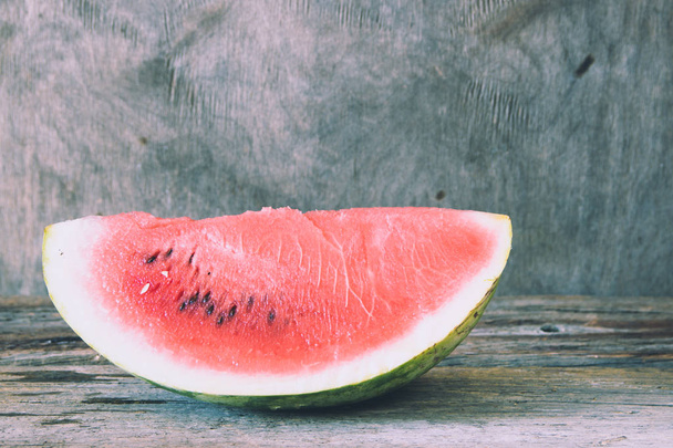 Watermelon on the wooden background. Organic watermelon - Photo, image