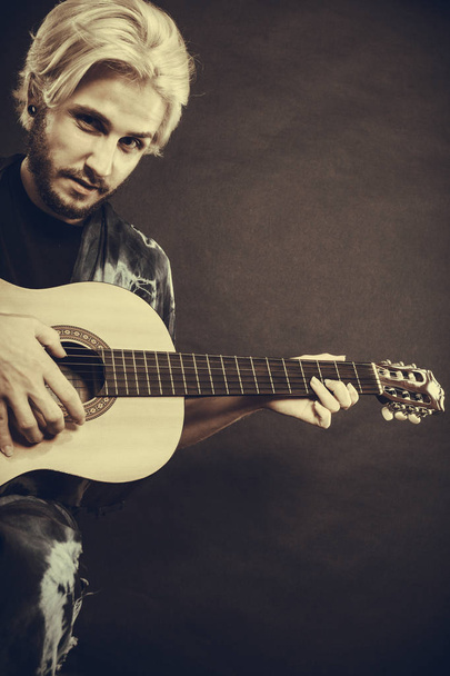 Blonde man playing acoustic guitar - Φωτογραφία, εικόνα