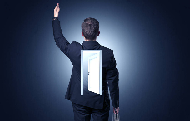 Businessman standing with door on his back - Photo, Image