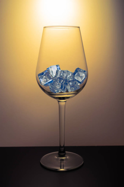 Wine glass filled with ice cubes - Valokuva, kuva