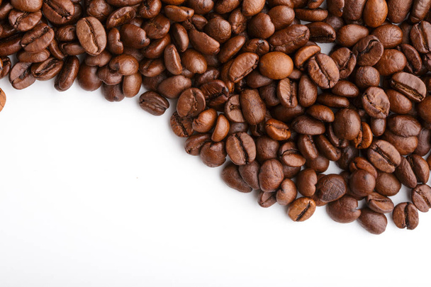roasted coffee beans isolated in white background. Roasted coffee beans background close up. Coffee beans pile from top on white background with copy space for text. Good morning. - Valokuva, kuva