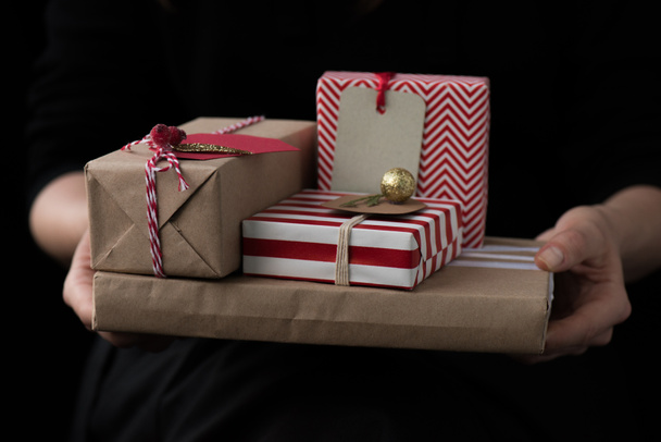 woman holding christmas gifts - 写真・画像