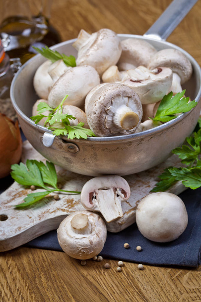 Fresh champignon mushrooms on wooden - Photo, Image