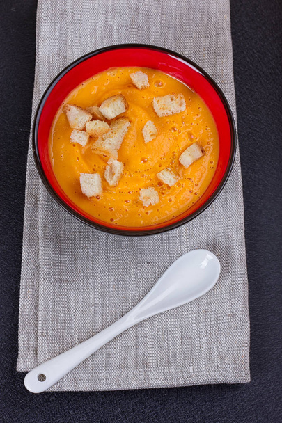 Pumpkin and carrot soup with cream and parsley - Photo, Image