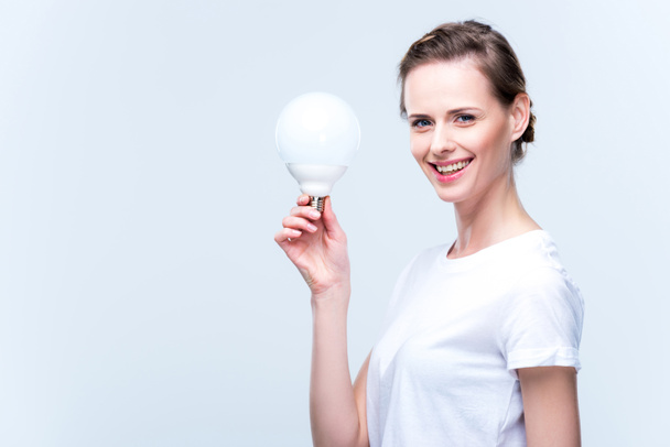 woman with light bulb - Foto, Imagen