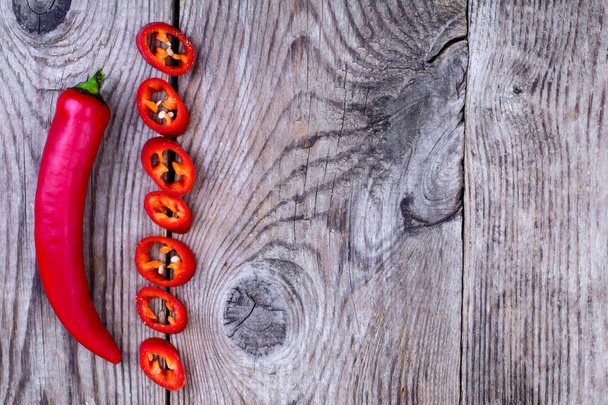 Hot pepper on wooden table - Photo, Image