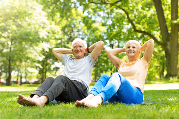 Senior Couple Exercising In Park - Photo, Image