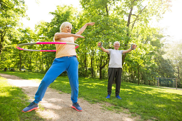 Senior Couple Exercising In Park - Fotografie, Obrázek
