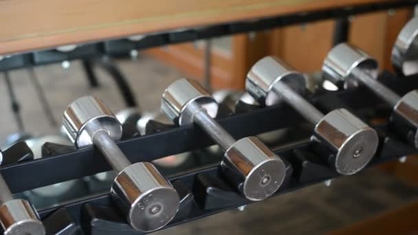 Many sports dumbbells in gym - Footage, Video
