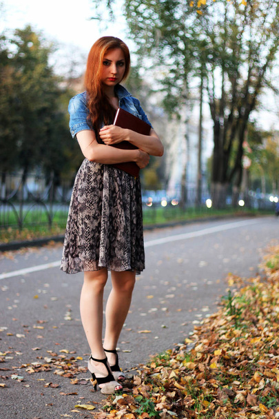 red-haired girl in a park sunny day outdoor - Photo, Image