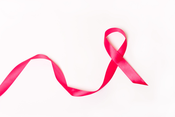 Pink ribbon on white background.  - Photo, Image