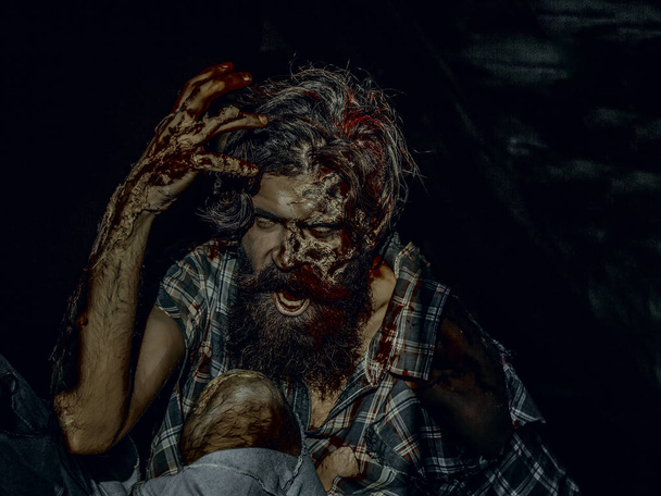 Halloween man with bloody hands on dark background - Φωτογραφία, εικόνα