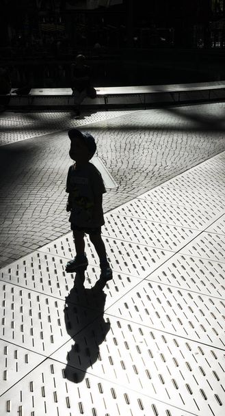 Light and shadows of people at Potsdamer Platz in Berlin   - Photo, Image