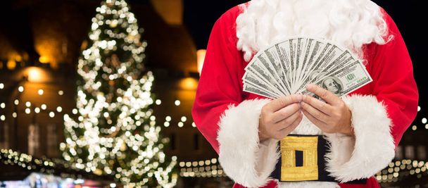 close up of santa claus with dollar money - Foto, Bild