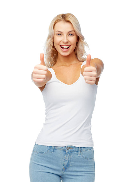 happy young woman showing thumbs up - Foto, imagen