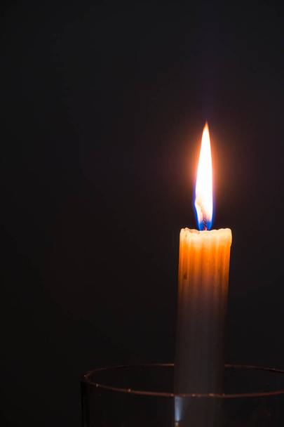 single candle on a black candle - Photo, Image