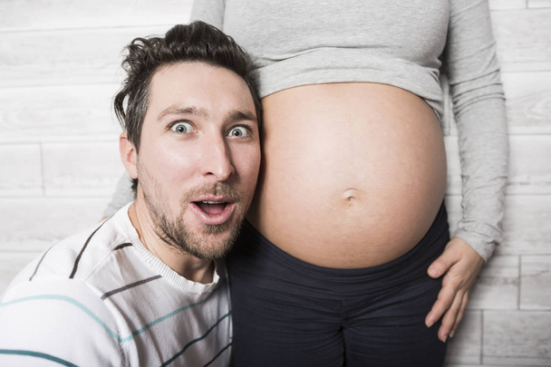 Pregnant Mother and her husband on baby room - Fotografie, Obrázek