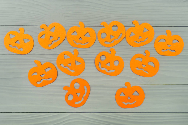 Many different halloween pumpkin paper silhouettes - Фото, изображение