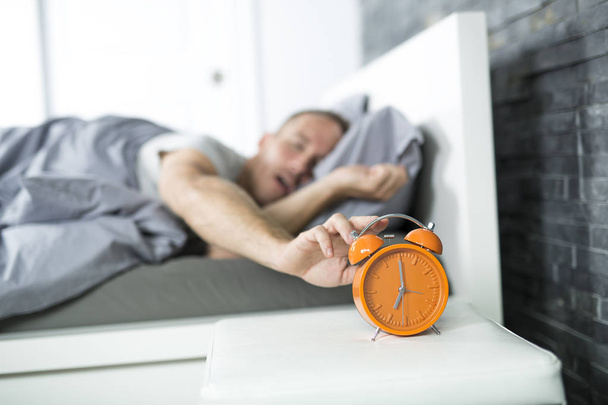 Time to wake up. Tired man in the bed - Fotoğraf, Görsel