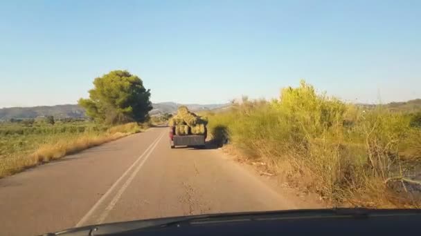 Farm vehicle transports hay to feed the animals. - Footage, Video