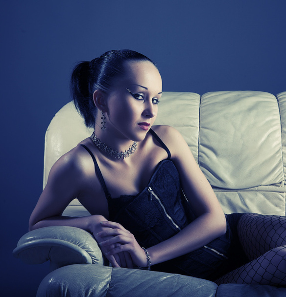 Portrait of sexy young model on sofa - Foto, Imagem