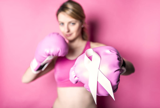 Fight for Breast Cancer woman with symbol on pink background - Fotó, kép
